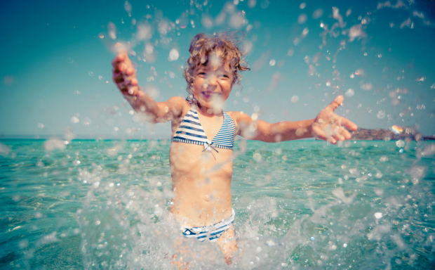 a girl in a swimsuit in the water