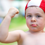 Confident child with swimming pool cap